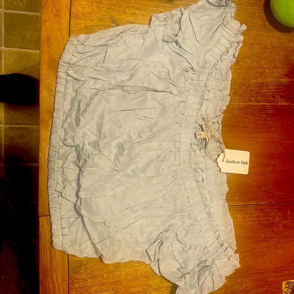 Cozy casual, this is a mid top beautiful blue grey. This top has never been worn